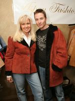 Travis Aaron Wade and Gwen wearing His & Her Cherry Shearling Jackets Model 87H SOLD OUT